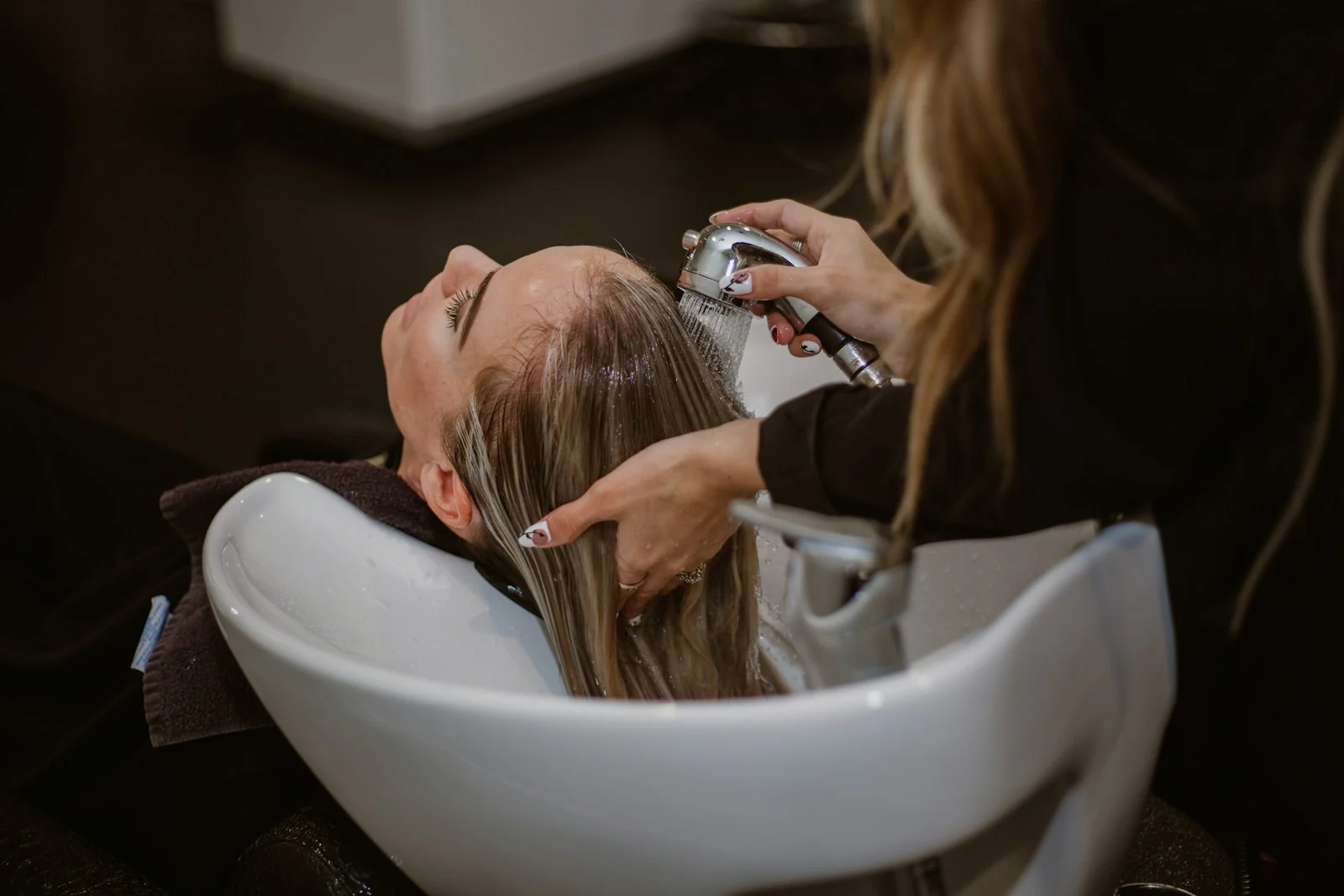 Hairdresser working with a client in a salon
